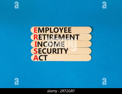 ERISA symbol. Concept words ERISA employee retirement income security act on wooden stick. Beautiful blue table blue background. Business ERISA employ Stock Photo