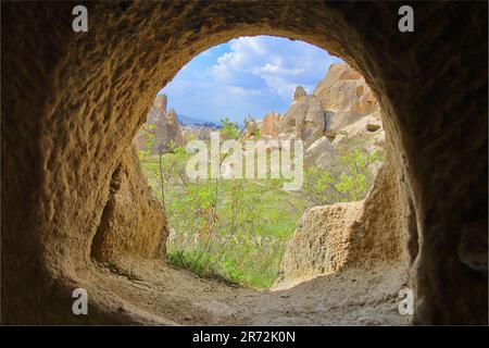 Photo taken in Turkey. The picture shows a window from a cave dwelling in the mountains of Cappadocia. Stock Photo