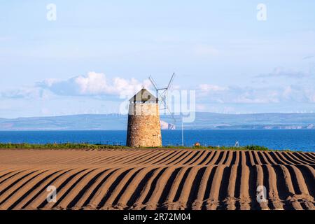 St Monans Windmill, pre-planting field, St Monans, Fife, Scotland, UK Stock Photo