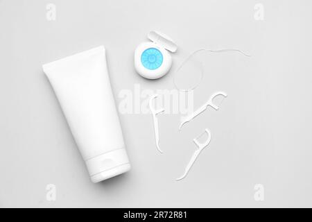dental-floss-and-toothpicks-on-grey-background-stock-photo-alamy