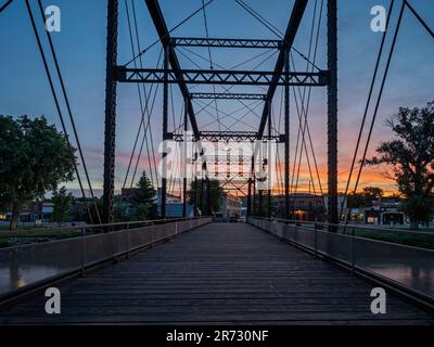 Sunset view of Fort Benton, Montana from a pedestrian bridge over the Missouri River Stock Photo