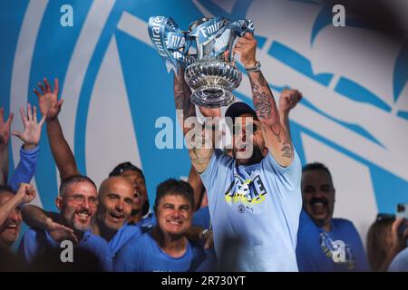 Kyle Walker #2 of Manchester City lifts the FA Cup on stage during Manchester City's Treble victory parade at St Peter’s Square, Manchester, United Kingdom, 12th June 2023  (Photo by Mark Cosgrove/News Images) Stock Photo