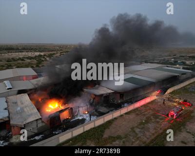 Jahra, Kuwait. 12th June, 2023. A vehicle is destroyed in a fire at a ...