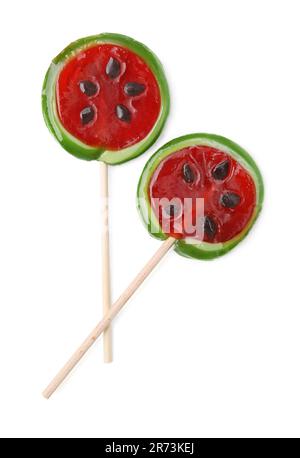 Watermelon shaped lollipops on sticks against white background, top view Stock Photo