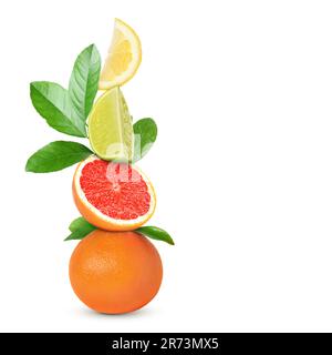Stack of different fresh citrus fruits with green leaves on white background Stock Photo