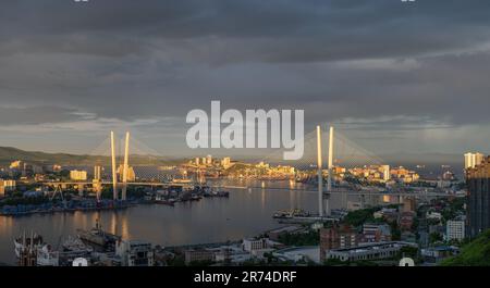 VLADIVOSTOK, RUSSIA - JUNE 3, 2023: View of the bridge at dawn. Cityscape. Stock Photo