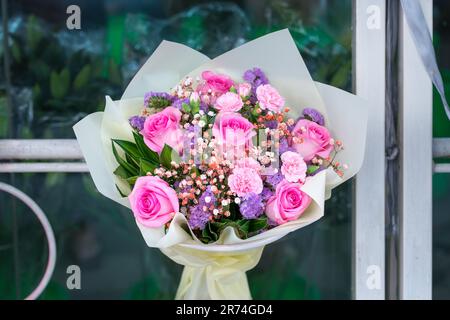 Beautiful bouquet of pink roses on display in a florist shop. Stock Photo