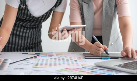 Designer using laptop to design fashion clothes. Fashion Design Concept Stock Photo