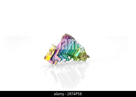 bismuth crystal isolated on white blackground. macro detail  background. close-up Rough raw unpolished semi-precious gemstone. Stock Photo