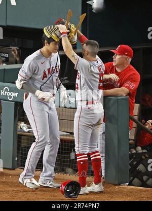 Shohei Ohtani (L) of the Los Angeles Angels has a home run celebration  helmet placed on his head during the 12th inning of a baseball game against  the Texas Rangers at Globe