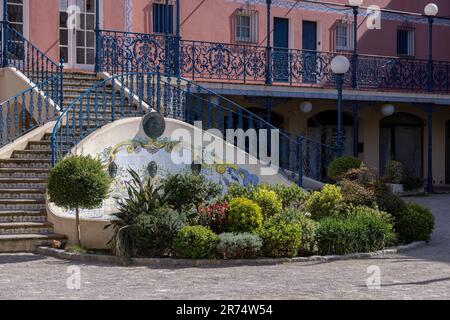 Port Grimaud with decorative fountain made of tiles and flowers in the town center Stock Photo