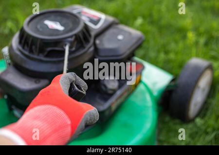 Gasoline lawn mower start, detail, handle, pulley, lawn mower, lawn mowing, garden, Stock Photo
