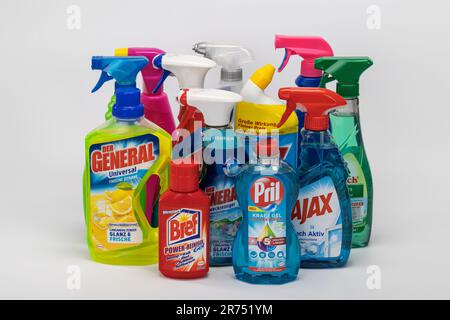 Household cleaners of different brands, white background, Stock Photo