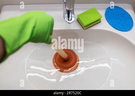https://l450v.alamy.com/450v/2r7520c/sink-clogged-drain-unclog-with-the-plunger-2r7520c.jpg