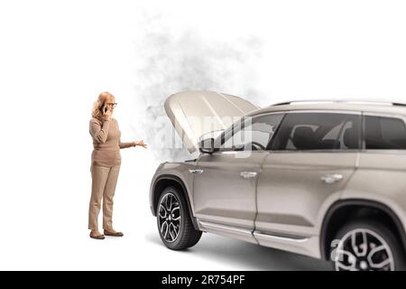 Woman calling a road help service for her vehicle isolated on white background Stock Photo