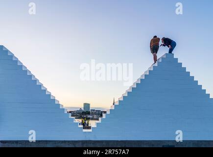 Bremen, sculpture 'Three Triangles' ('Outdoor Piece for Bremen'), by artist Sol LeWitt, persons climb on it, river Weser, Germany Stock Photo