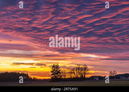 powerful evening red, the sun illuminates the underside of stratocumulus clouds, Germany, Bavaria Stock Photo