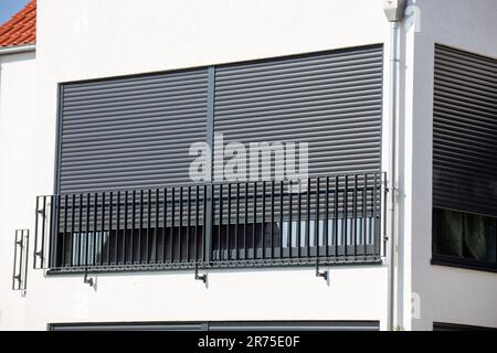 Electric aluminium roller shutter on a new residential building Stock Photo
