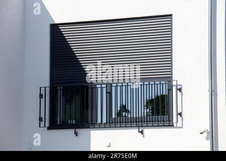 Electric aluminium roller shutter on a new residential building Stock Photo