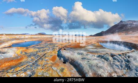 Breathtaking boiling mudpots in geothermal area Hverir and cracked ground around. Location: Hverir, Myvatn region, North part of Iceland, Europe Stock Photo