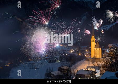New Year's Eve in Heiligenblut am Großglockner, St. Vincent's Church, fireworks Stock Photo