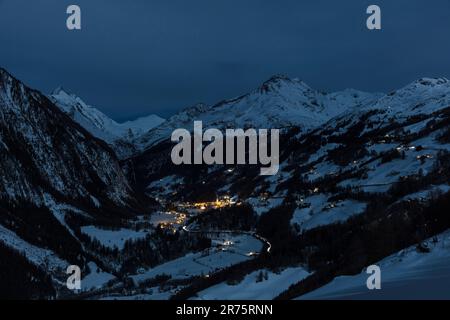 Heiligenblut on Großglockner in winter, night, illuminated, snow Stock Photo