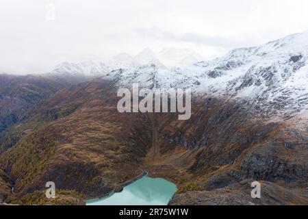 Snow covered mountain range in autumn, snow line, Margaritzenstausee, Schobergruppe Stock Photo