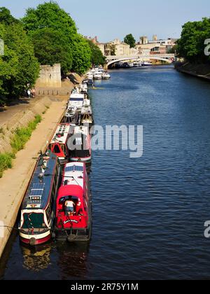 Narrowboats moored on the River Ouse from Scarborough Bridge York Yorkshire England Stock Photo