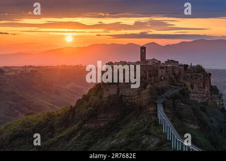 A sunrise at Civita di Bagnoregio, a remote village in the municipality of Bagnoregio in the province of Viterbo, Lazio, in central Italy. The only ac Stock Photo