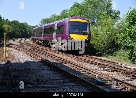 East Midlands Railway Turbostar 170532 passing Uttoxeter Signal Box with the 11:10 Crewe to Newark Castle service on 13 June 2023 Stock Photo