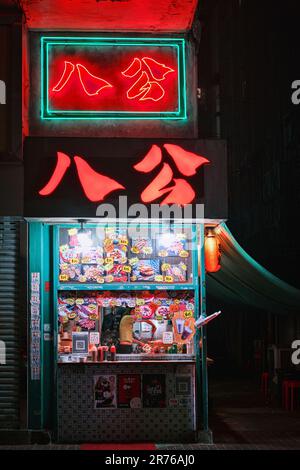 Mong Kok, Hong Kong - April 12 2023: View of night streets, neon signboards of stores Stock Photo
