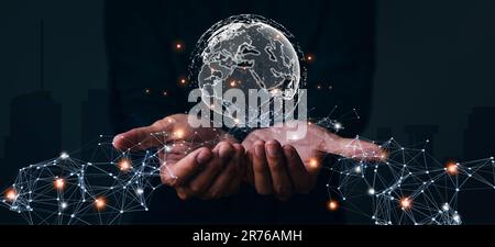 Businessman hand holding global network, futuristic technology background, Global business, internet network connection, IoT Internet of Things, busin Stock Photo