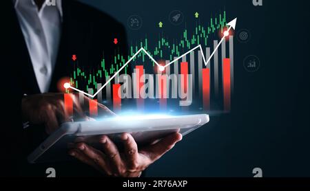 Businessman analyst working with digital finance business data graph showing technology of investment strategy for perceptive financial business decis Stock Photo