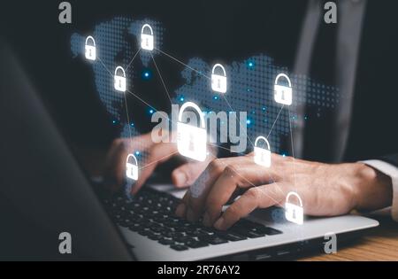 Cyber security and network protection, Private key concept, Young man using laptop with lock icon for business and internet. Stock Photo