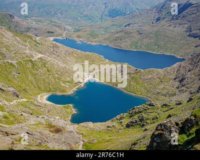 Lakes Glaslyn and Llyn Llydaw from the summit ridge of Yr Wyddfa Snowdon in the Snowdonia National Park North Wales Stock Photo