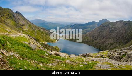 Panoramic view of the 'arms' of Snowdon Horseshoe with Crib Goch and Y Lliwedd enclosing Glaslyn lake on Yr Wyddfa Snowdonia National Park Wales UK Stock Photo