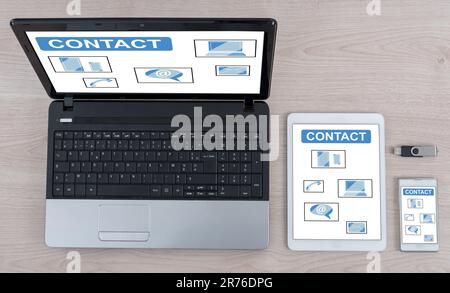 Contact concept shown on different information technology devices Stock Photo