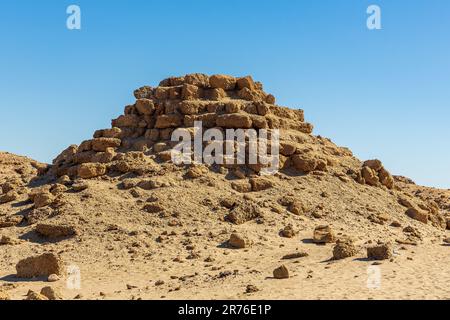 remains of one of the nubian pyramids of the black pharoahs of the napata kingdom of sudan  weatherbeaten and crumbling into the desert Stock Photo
