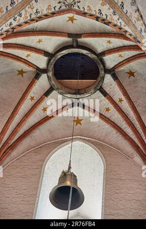 13 June 2023, Schleswig-Holstein, Lübeck: The first (754 kg) of the three bells is hoisted into the tower of St. Mary. The largest bell has a weight of 2353 kilograms. According to the parish, St. Marien has one of the largest peals of bells in Germany, with a total of twelve. Photo: Georg Wendt/dpa Stock Photo