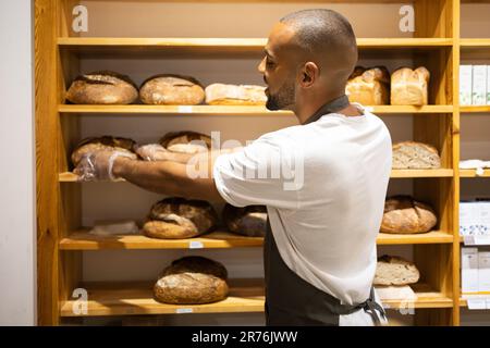 Handsome African American Baker Tray Fresh Loaves Bread Baking Manufacture  Stock Photo by ©ArturVerkhovetskiy 186864520