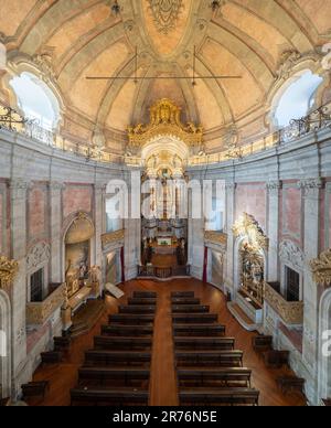 Interior of ancient historic Clerigos Church hall built in baroque style with dome located in Portugal Stock Photo