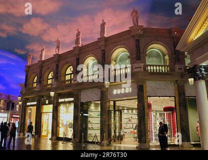 Interior of the Caesars Forum Shops shopping mall with Gucci and Louis  Vuitton shop fronts Las Vegas Nevada USA Stock Photo - Alamy