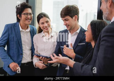 Group of multicultural business people standing in modern office Stock Photo