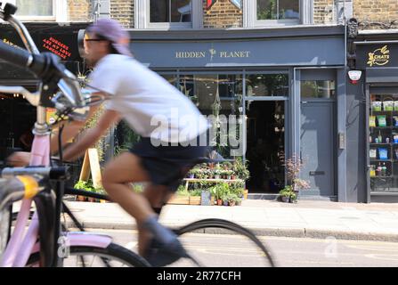 Clapton is being gentrified, as here on Chatsworth Road with a vibrant cafe & coffee culture, indie shops & a Sunday market, in east London, UK Stock Photo