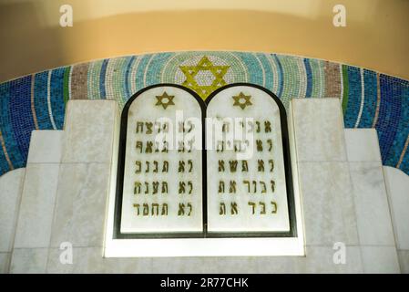 Stone Tablets With Ten Commandments in Hebrew Inside Jewish Temple Stock Photo