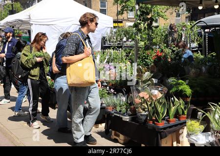 Clapton is being gentrified, as here on Chatsworth Road with a vibrant cafe & coffee culture, indie shops & a Sunday market, in east London, UK Stock Photo