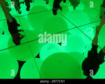 teamLab Planets, Tokyo: a room full of strings of LED lights, mirrored ...