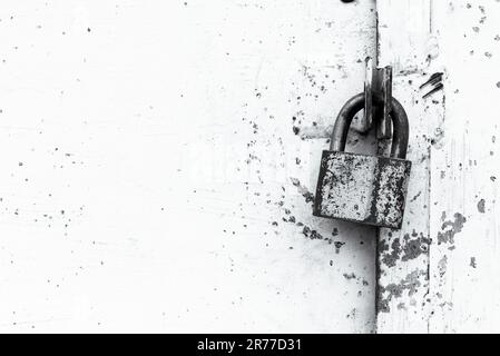 Old rusty lock on metal doors. Lock on the door with an empty place for an inscription Stock Photo