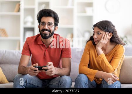 Boring Date. Excited Black Guy Playing Video Games and Ignoring Girlfriend  Next To Him Stock Image - Image of enjoy, conflict: 188745699