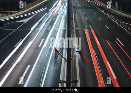 Light trails of car headlights and taillights. Driving cars captured with long exposure Stock Photo